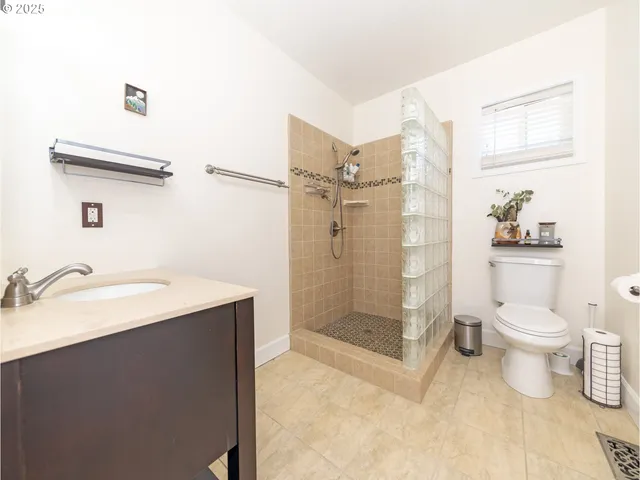 a view of a livingroom with wooden floor and a window
