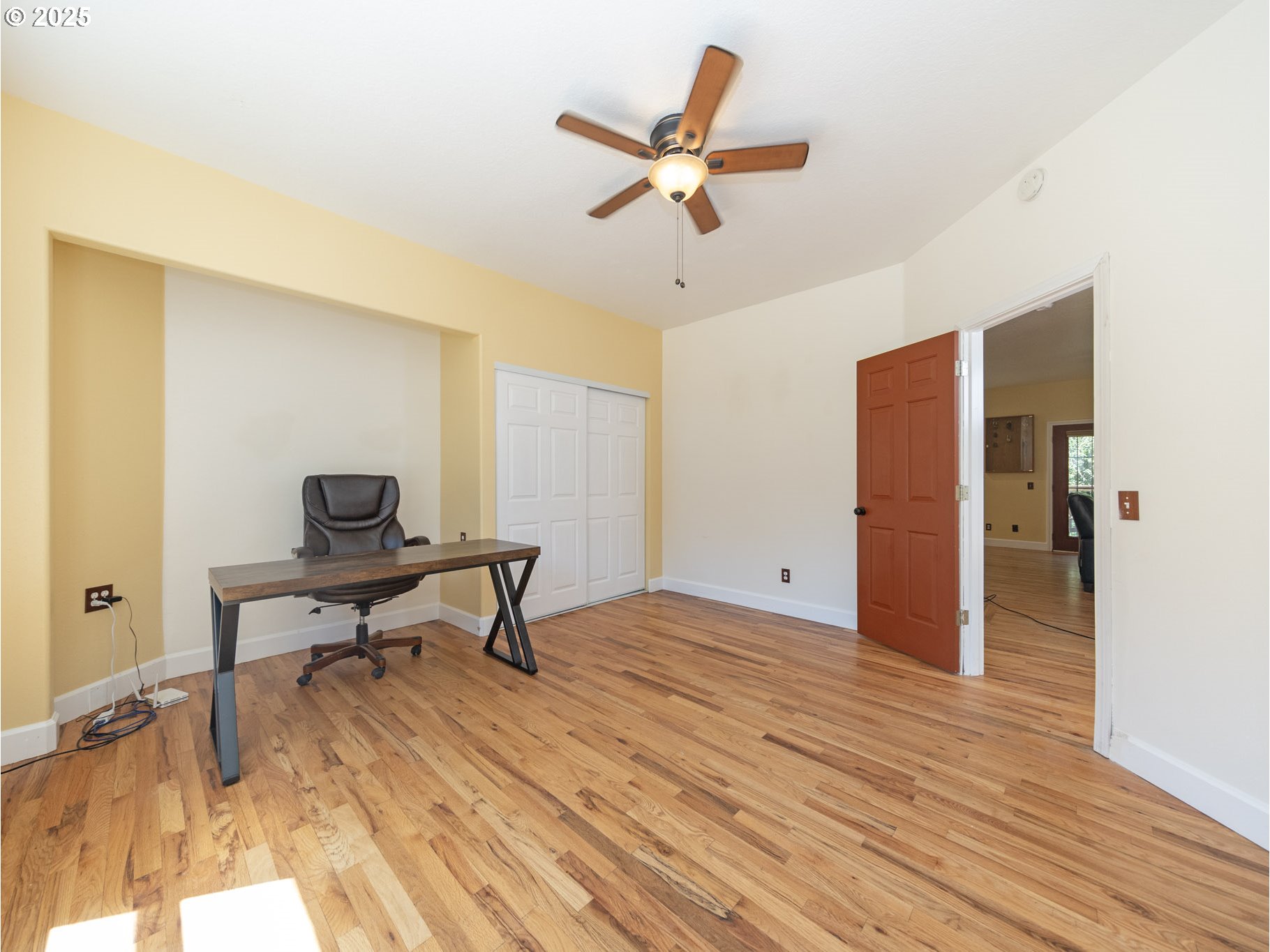 64977 Nehalem Highway North Vernonia, OR 97064 - Photo 18 of 48 a view of a workspace with wooden floor and a ceiling fan