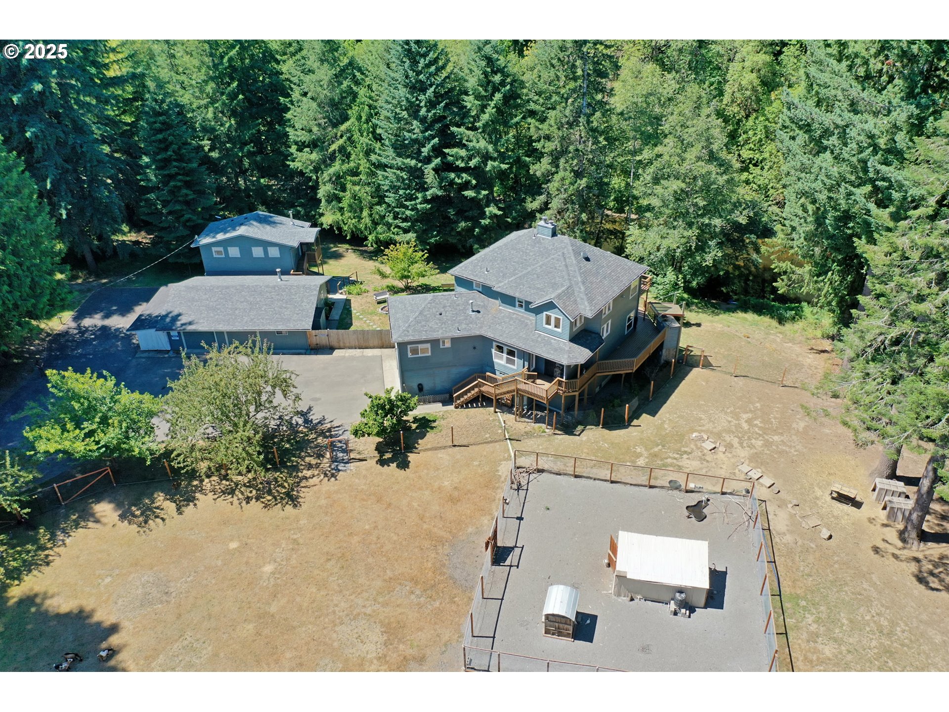 64977 Nehalem Highway North Vernonia, OR 97064 - Photo 2 of 48 an aerial view of a house with a yard basket ball court and outdoor seating