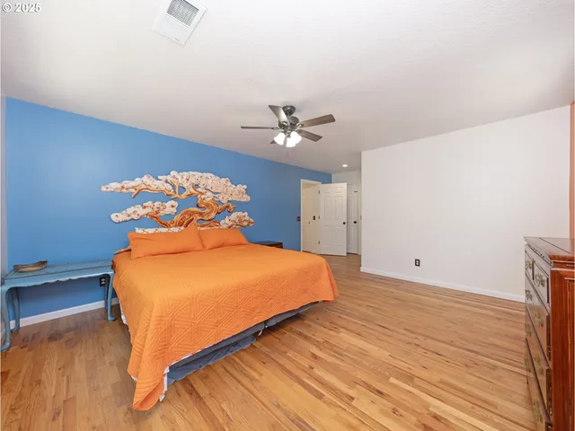 a spacious bathroom with a double vanity sink and a mirror
