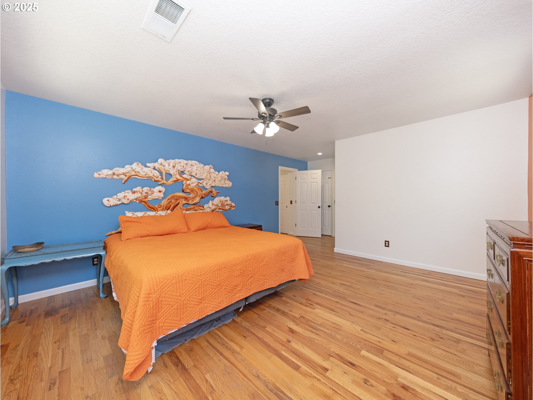 64977 Nehalem Highway North Vernonia, OR 97064 - Photo 21 of 48 a bedroom with a bed and a ceiling fan