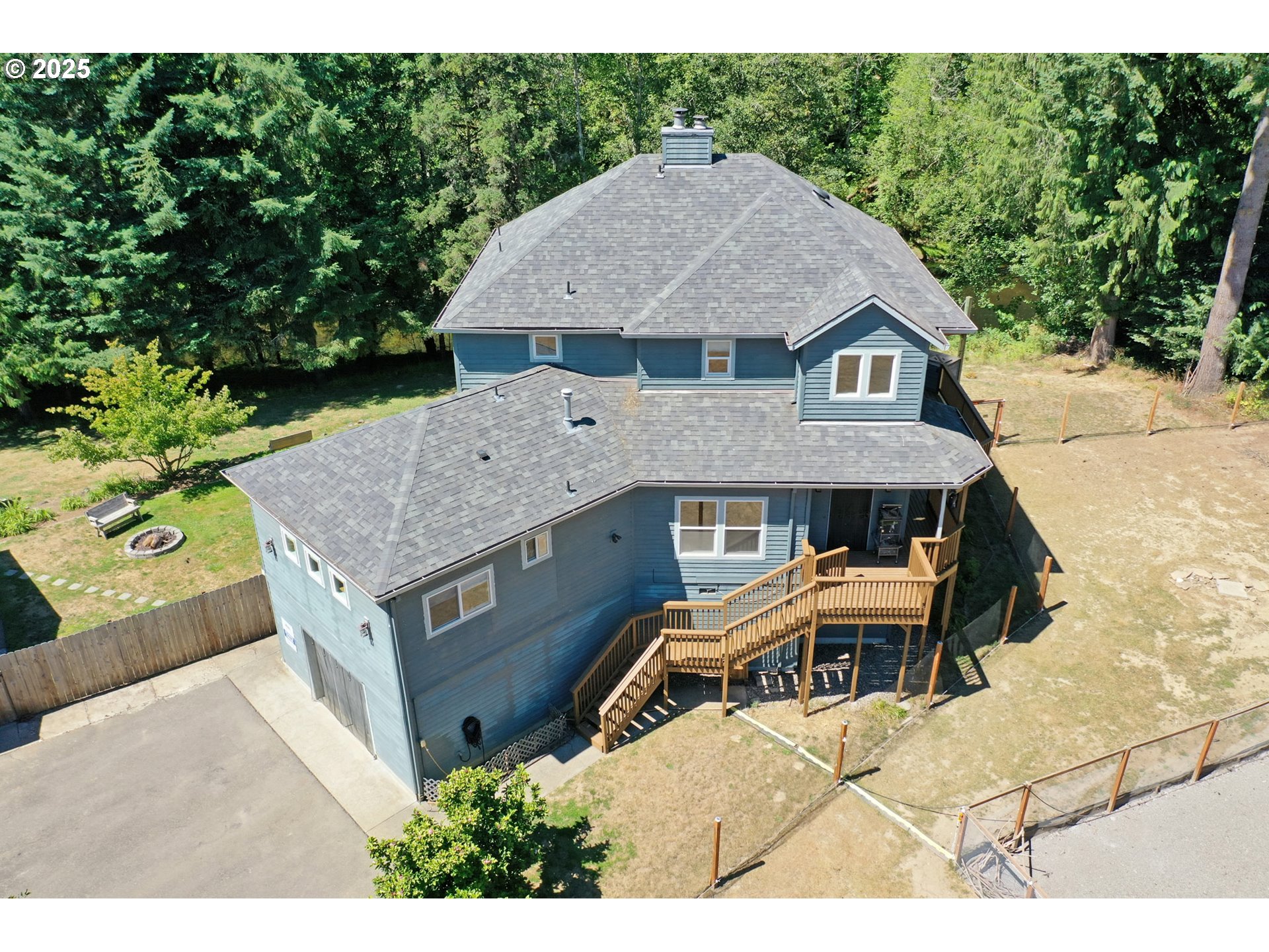 64977 Nehalem Highway North Vernonia, OR 97064 - Photo 4 of 48 a aerial view of a house with a yard and sitting area