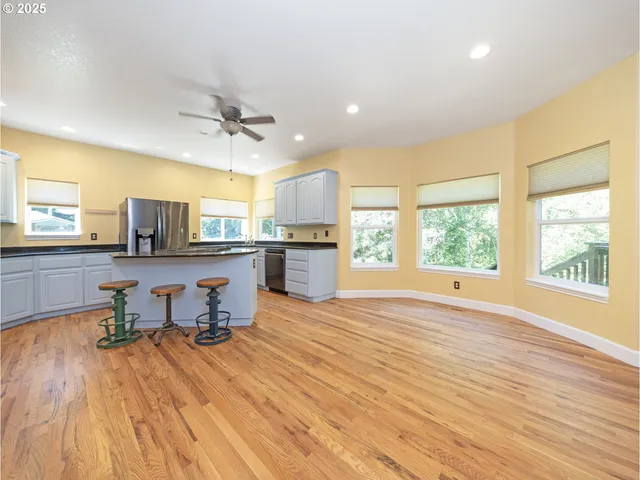a view of a kitchen with a sink and a window