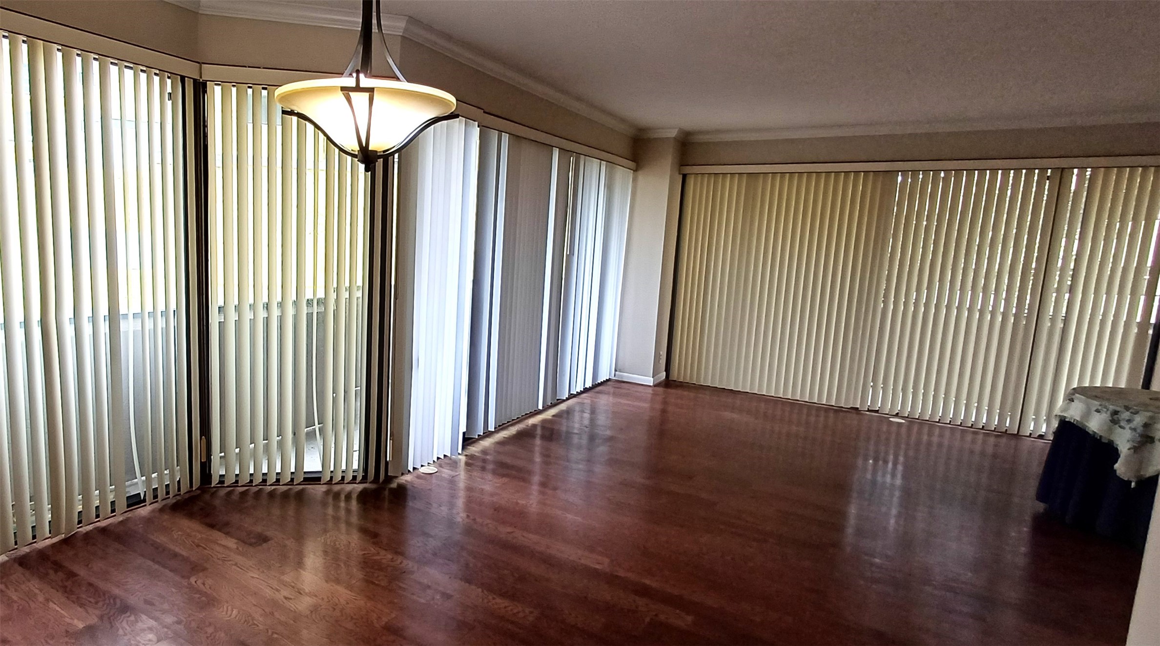 3350 McCue Road, Unit 201 Houston, TX 77056 - Photo 11 of 39 an empty room with wooden floor chandelier and windows