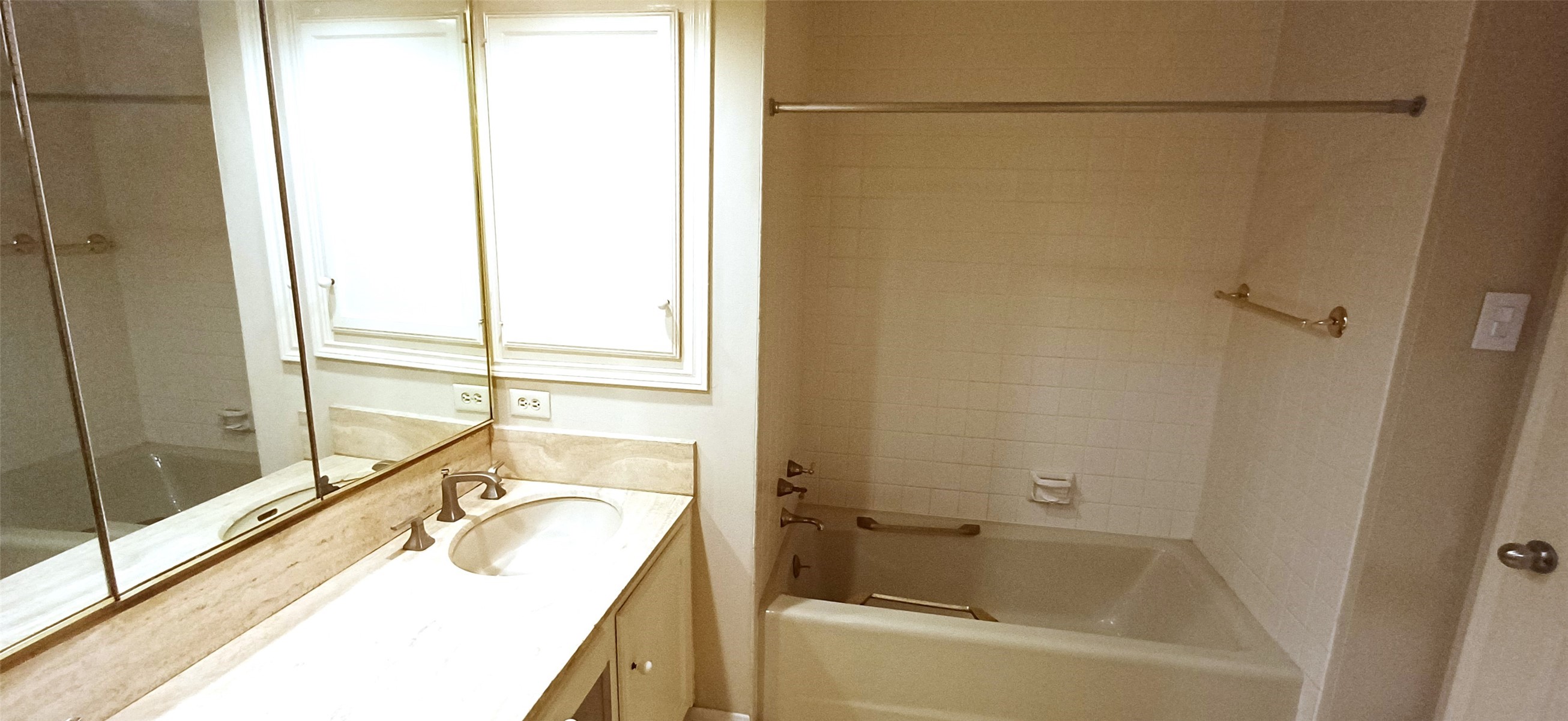 3350 McCue Road, Unit 201 Houston, TX 77056 - Photo 20 of 39 a bathroom with a tub sink vanity and a granite