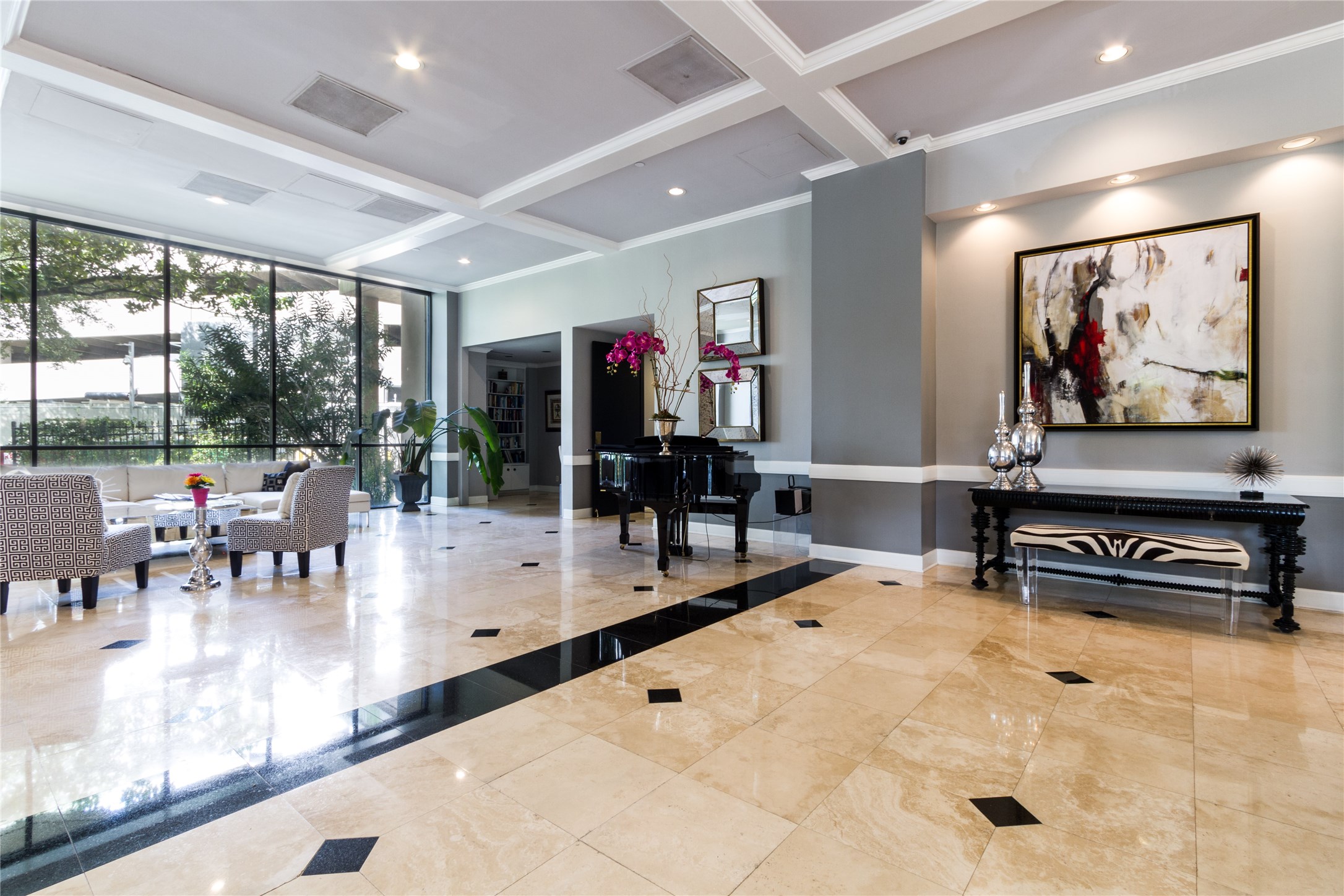 3350 McCue Road, Unit 201 Houston, TX 77056 - Photo 2 of 39 a lobby with furniture and a flat screen tv