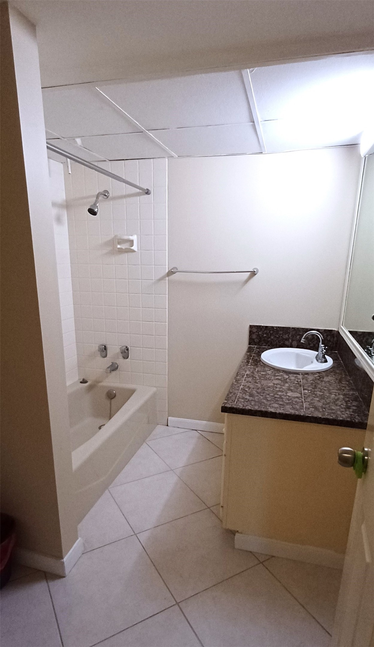 3350 McCue Road, Unit 201 Houston, TX 77056 - Photo 30 of 39 a bathroom with a granite countertop sink a toilet and bathtub