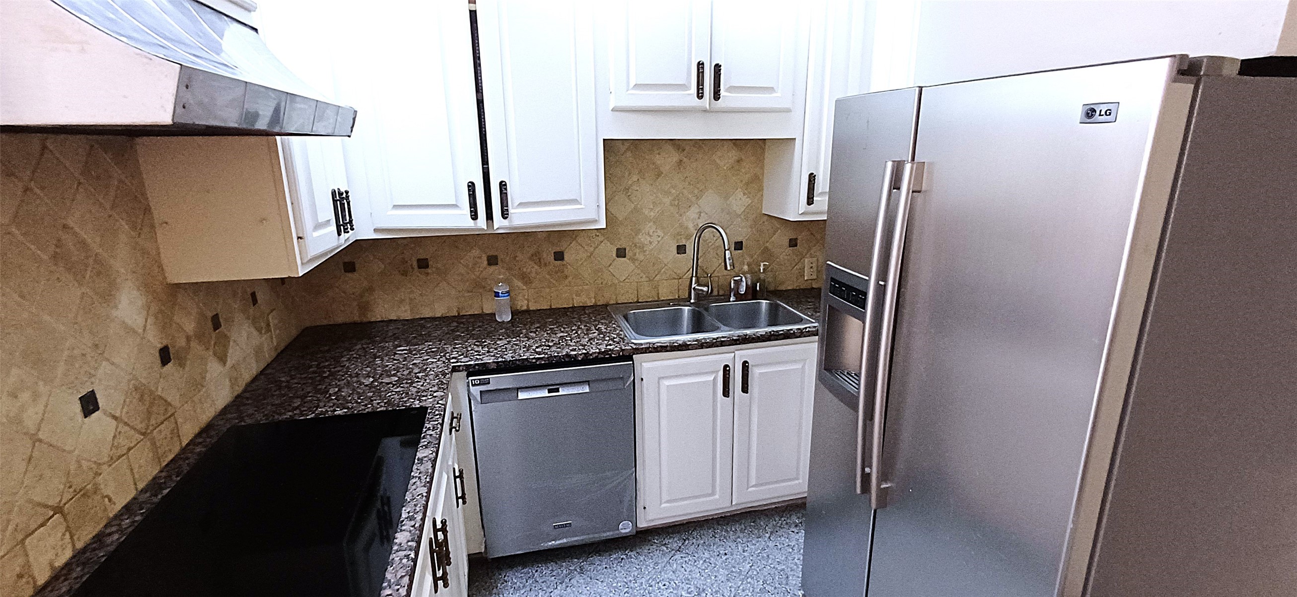 3350 McCue Road, Unit 201 Houston, TX 77056 - Photo 6 of 39 a kitchen with stainless steel appliances granite countertop a refrigerator and a stove