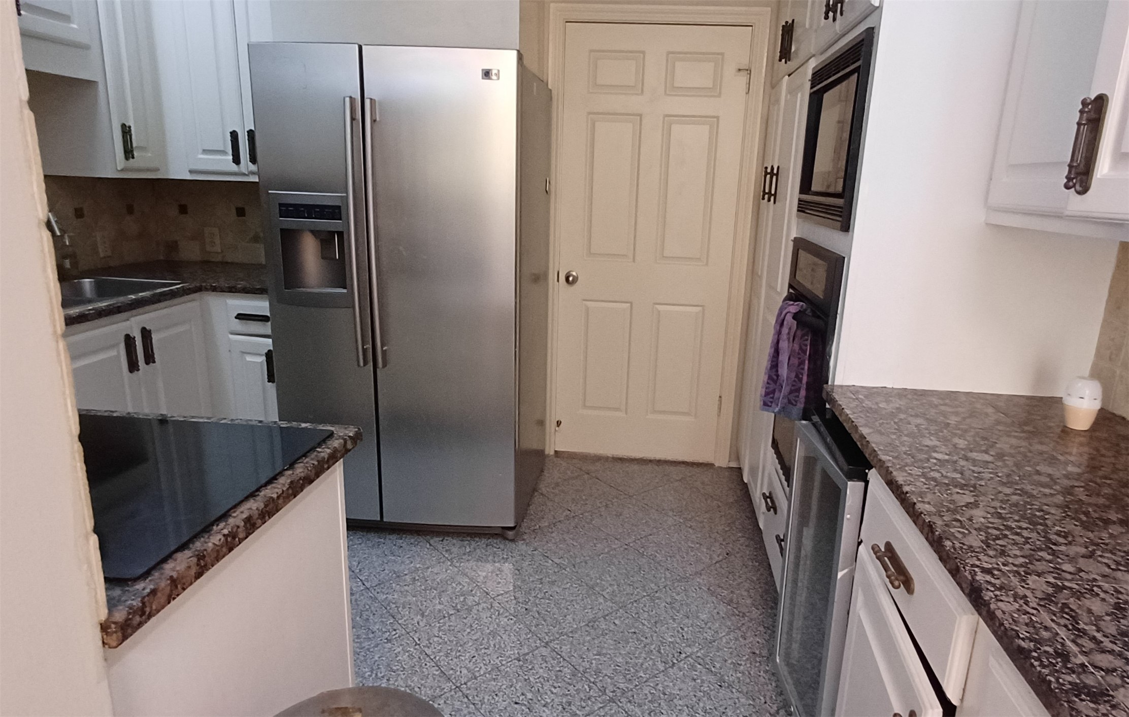 3350 McCue Road, Unit 201 Houston, TX 77056 - Photo 7 of 39 a kitchen with stainless steel appliances granite countertop a refrigerator and a sink