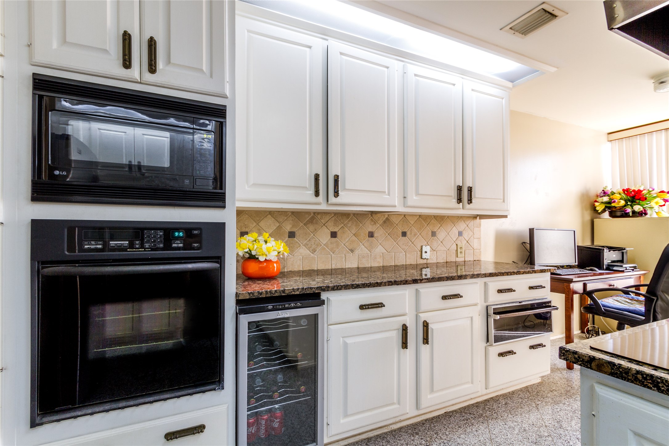 3350 McCue Road, Unit 201 Houston, TX 77056 - Photo 8 of 39 a kitchen with granite countertop a stove top oven microwave and cabinets
