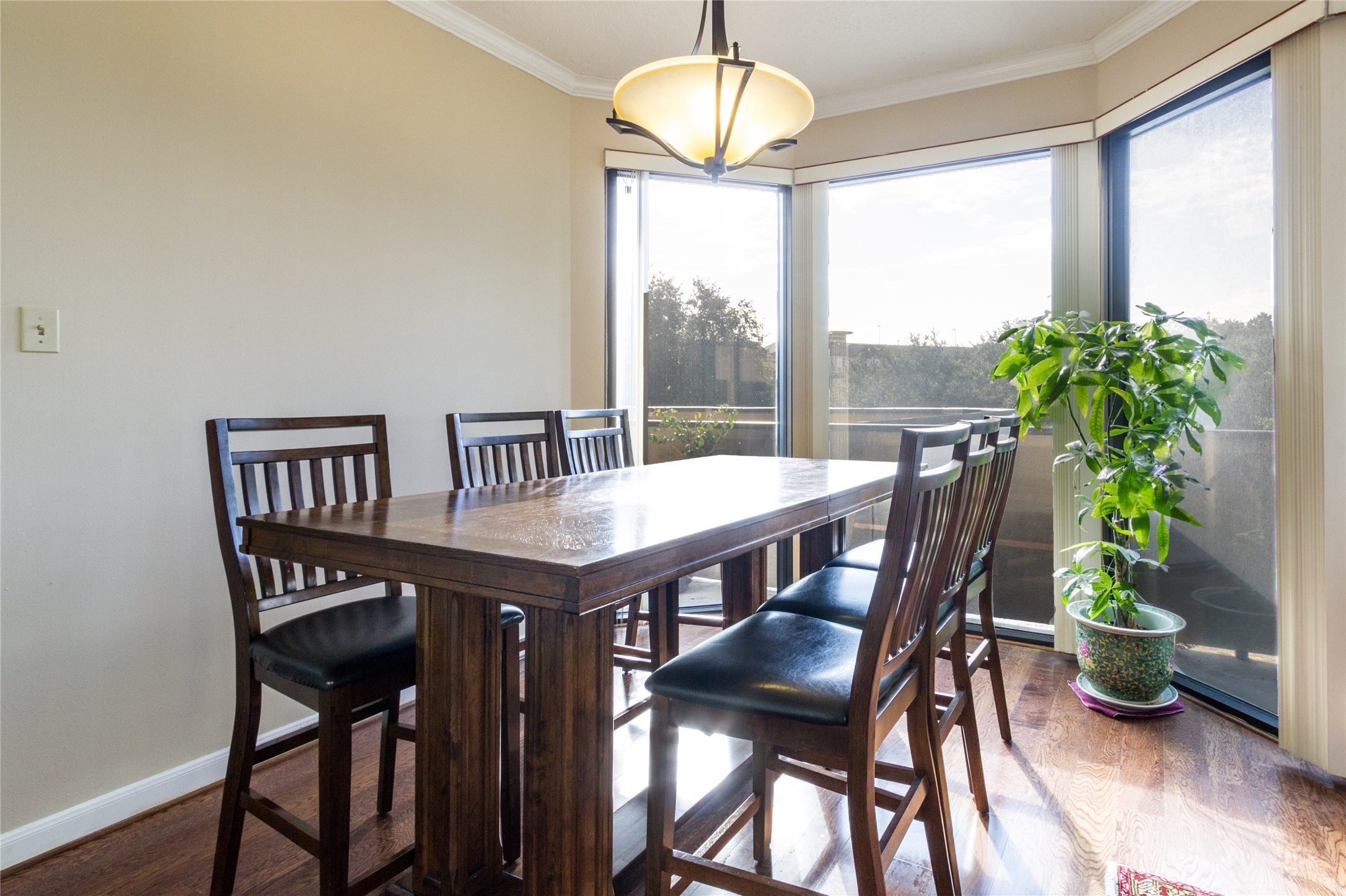 3350 McCue Road, Unit 201 Houston, TX 77056 - Photo 9 of 39 a view of a dining room with furniture window and wooden floor