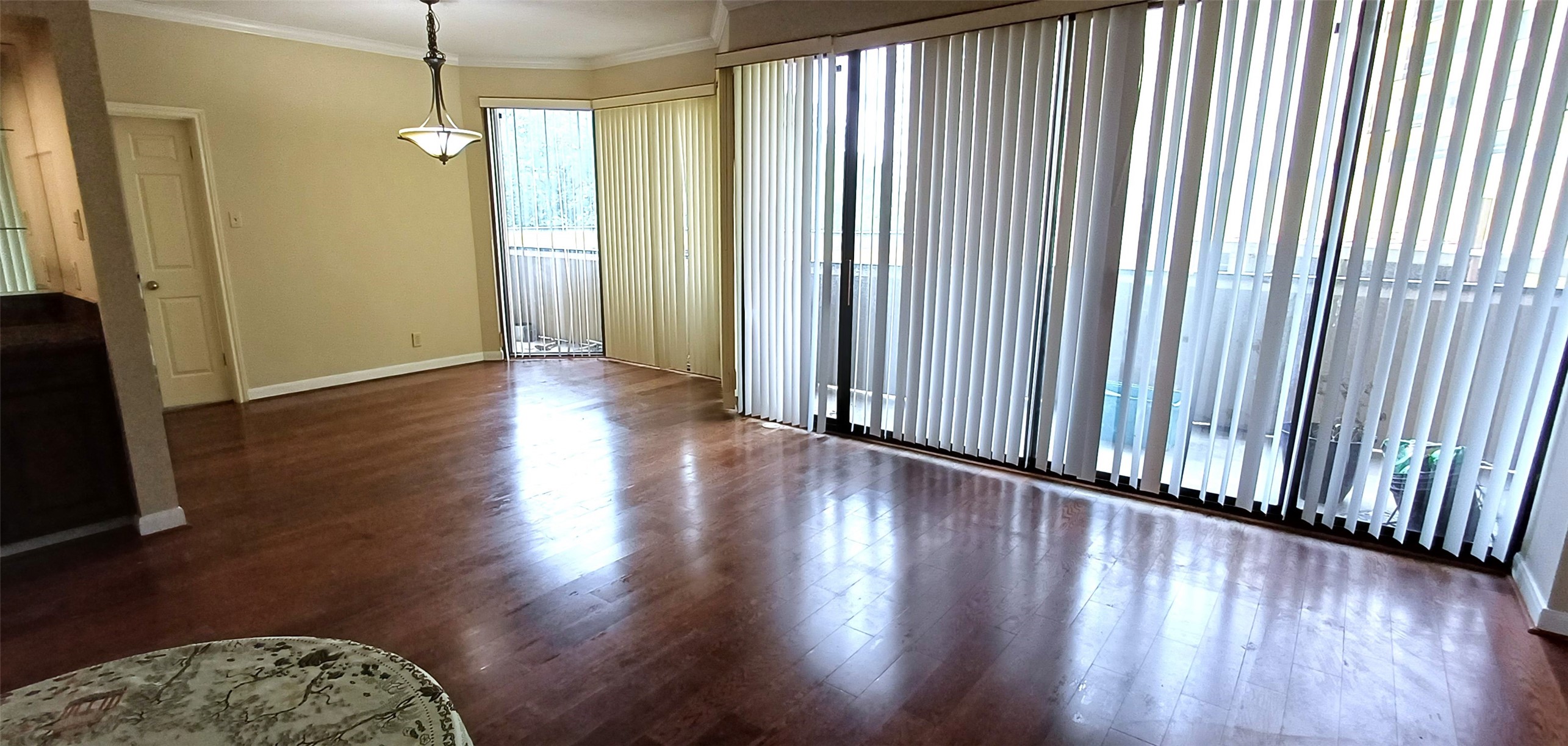 3350 McCue Road, Unit 201 Houston, TX 77056 - Photo 10 of 39 an empty room with wooden floor and windows