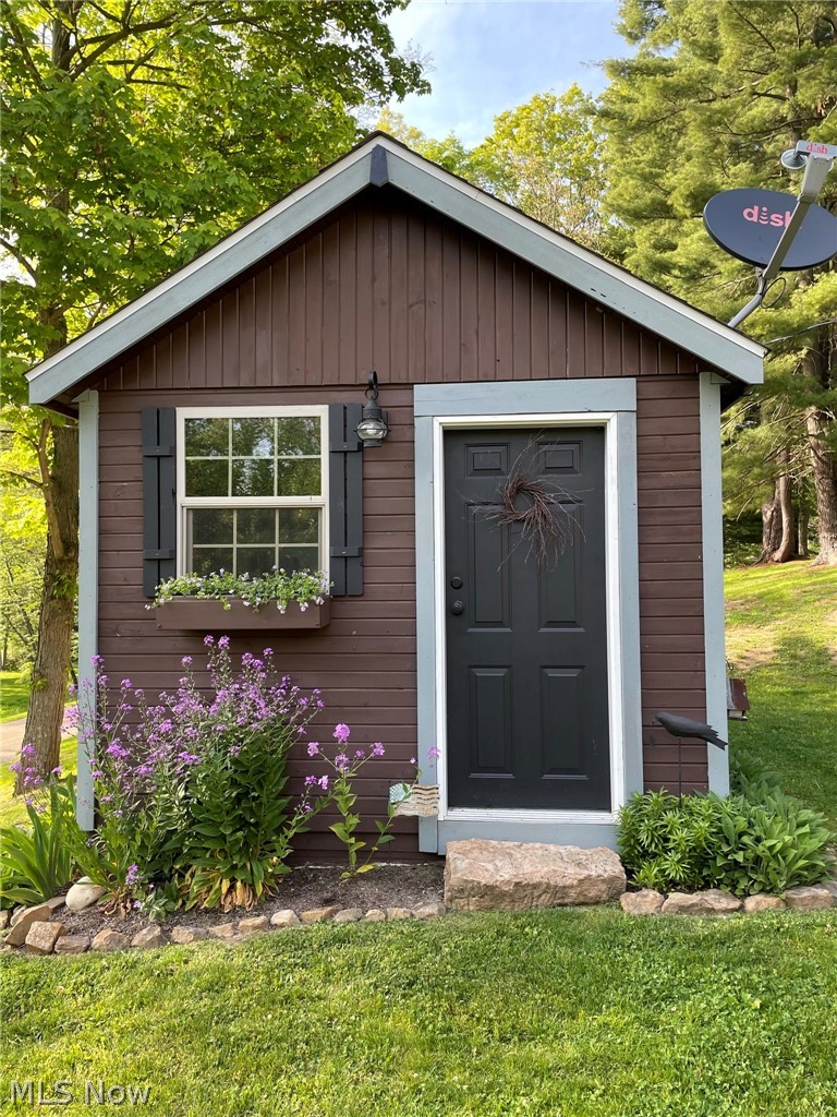 6203 Middle Run Road Dover, OH 44622 - Photo 8 of 27 A nice little she-shed for all the lawn tools