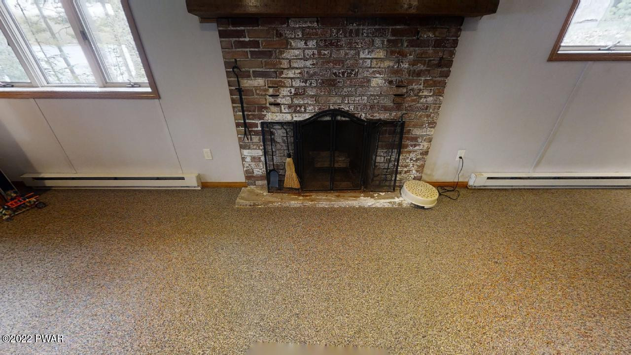 115 West Shore Road Shohola, PA 18458 - Photo 21 of 35 family room fireplace