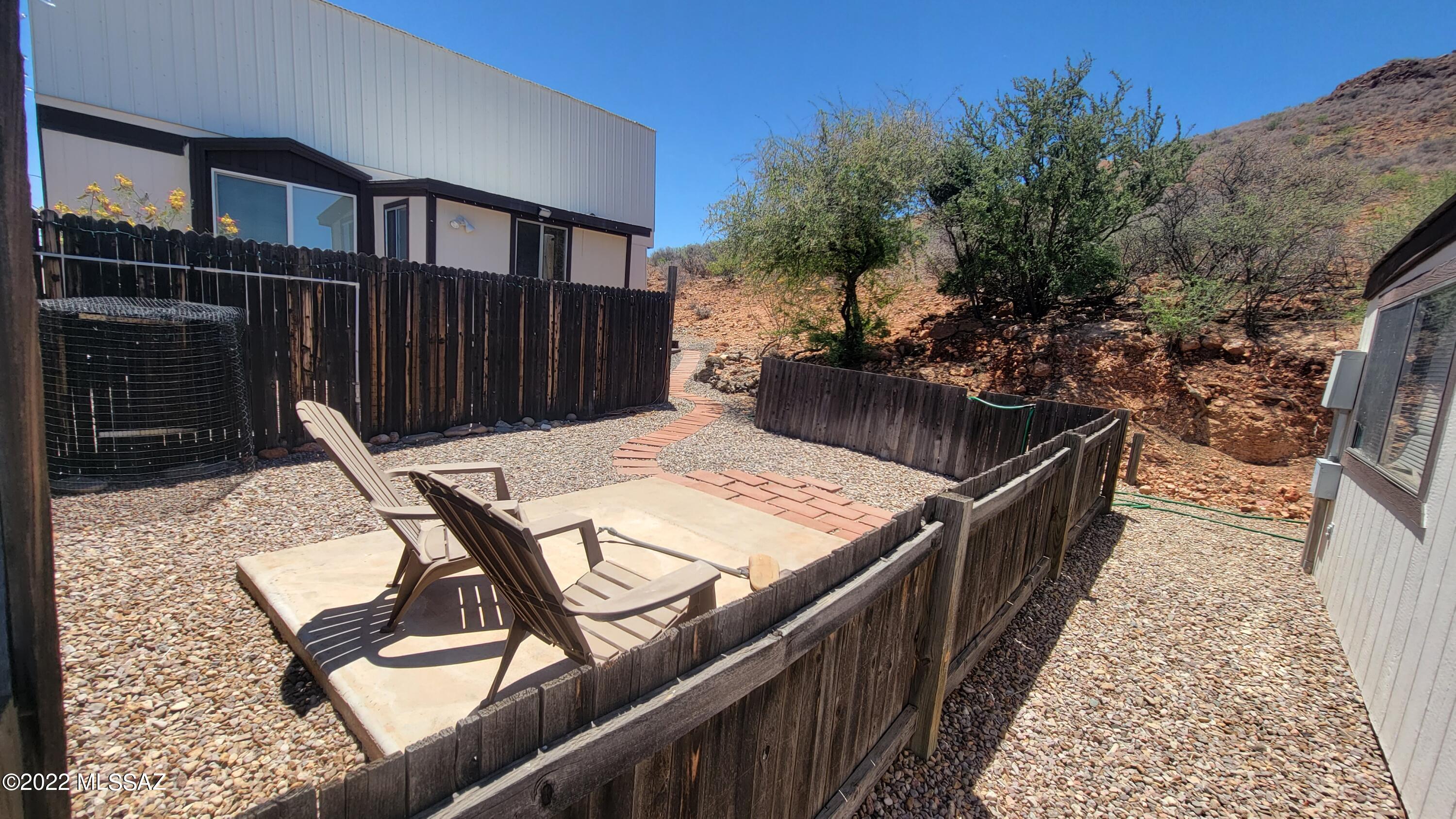 3399 Red Stag Road Pearce, AZ 85625 - Photo 12 of 47 a balcony with table and chairs