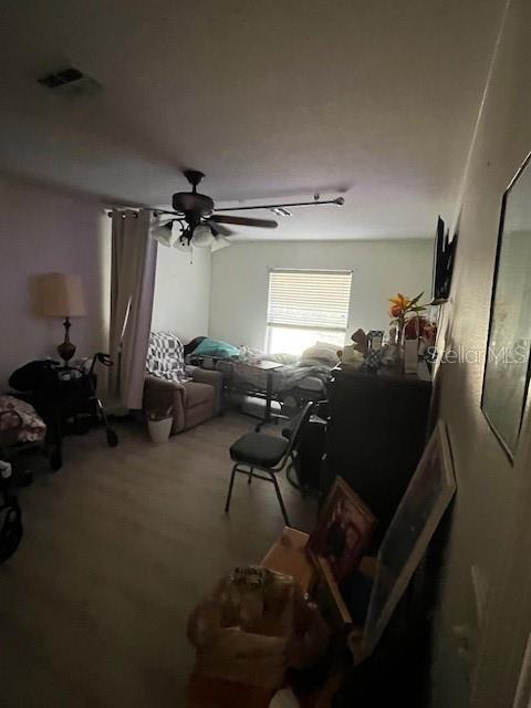 3010 Greynolds Avenue Spring Hill, FL 34608 - Photo 2 of 11 a room with furniture and a chandelier