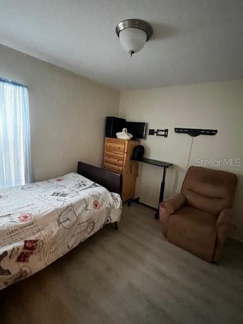 3010 Greynolds Avenue Spring Hill, FL 34608 - Photo 4 of 11 a bedroom with bed and window