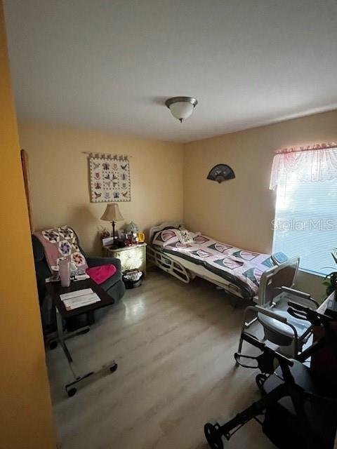 3010 Greynolds Avenue Spring Hill, FL 34608 - Photo 5 of 11 a bedroom with furniture and a window