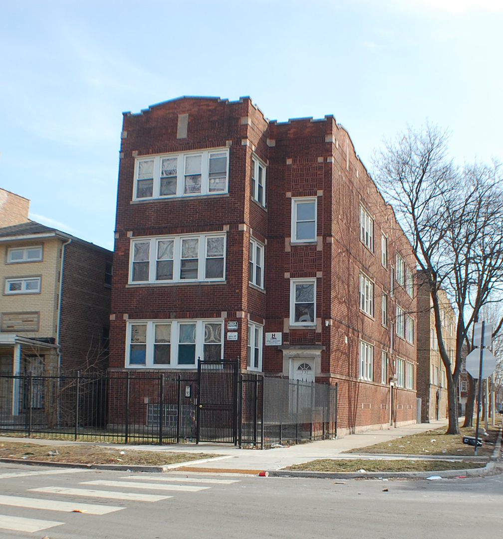a view of a building with a street