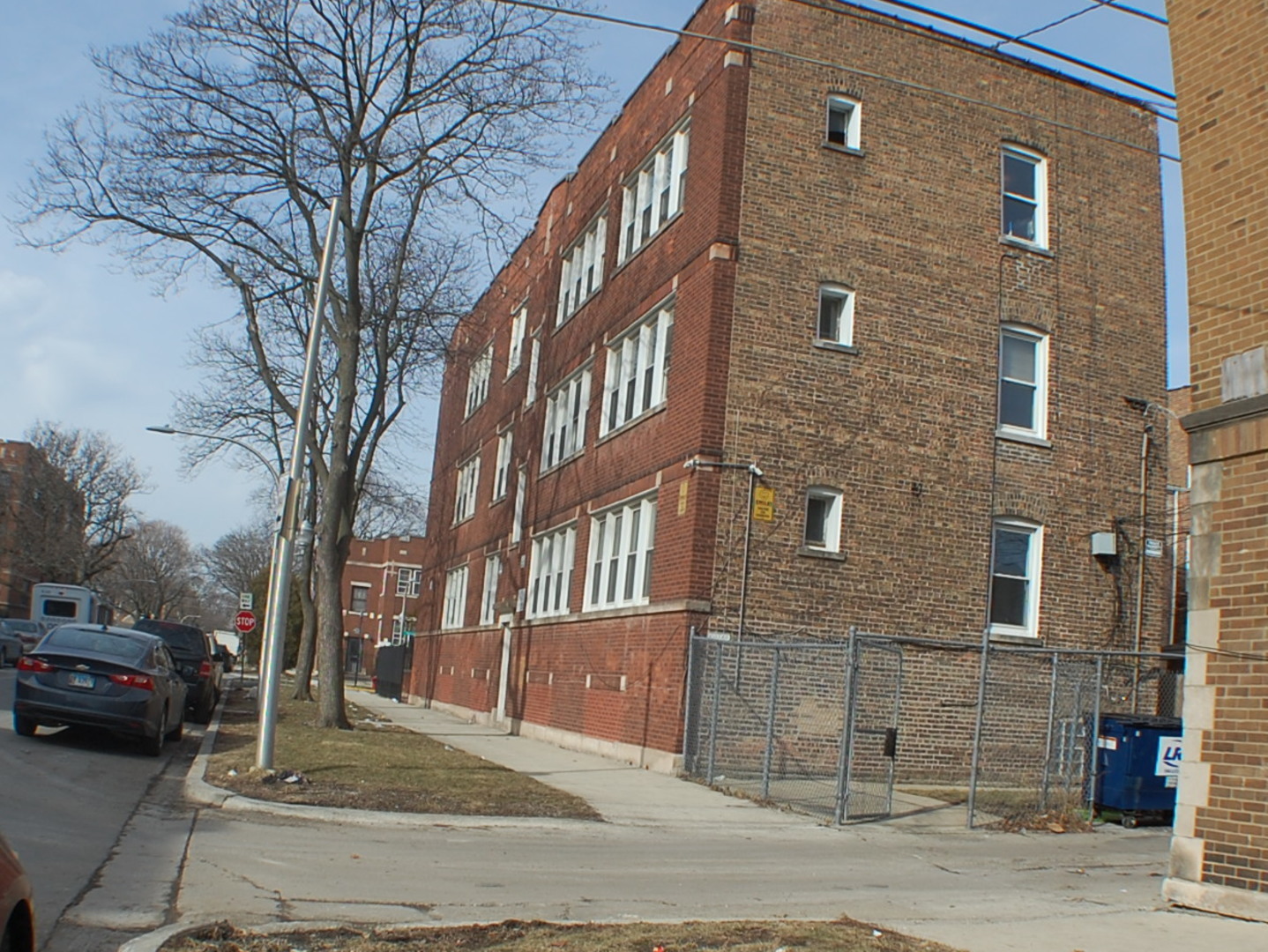 7757 South Paulina Street Chicago, IL 60620 - Photo 17 of 17 a view of a brick building next to a road