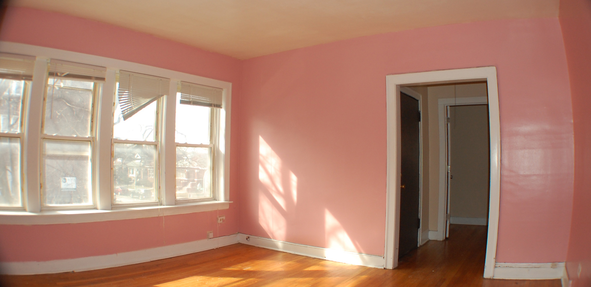 7757 South Paulina Street Chicago, IL 60620 - Photo 4 of 17 a view of empty room with wooden floor and fan