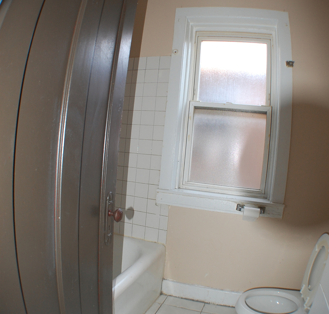 7757 South Paulina Street Chicago, IL 60620 - Photo 7 of 17 a bathroom with a granite countertop sink and toilet