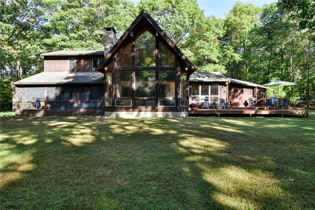 55 Ridge Drive Exeter, RI 02822 - Photo 27 of 37 exterior, showcasing the large, cathedral great room
55 Ridge Dr Exeter, RI 02822
