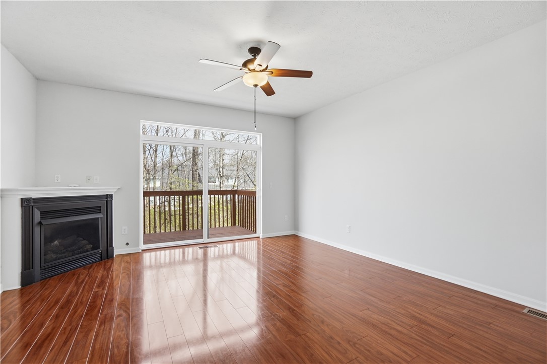 4294 Straight Arrow Road Dayton, OH 45430 - Photo 9 of 41 This airy space features warm hardwood flooring, a cozy fireplace, and direct access to a private deck.