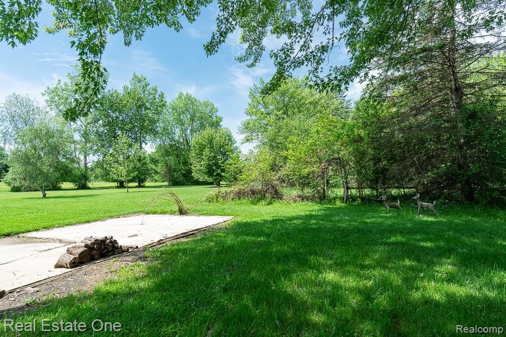 1056 Adams Road Burton, MI 48509 - Photo 27 of 29 Parking pad behind garage