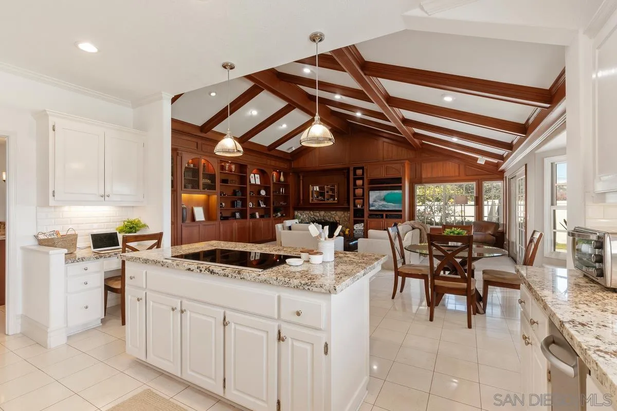 14134 Palisades Drive Poway, CA 92064 - Photo 15 of 32 a kitchen with stainless steel appliances kitchen island granite countertop a sink and cabinets