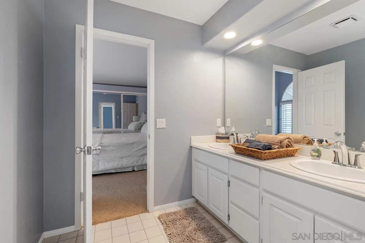 14134 Palisades Drive Poway, CA 92064 - Photo 25 of 32 a en suite bathroom with a sink and mirror