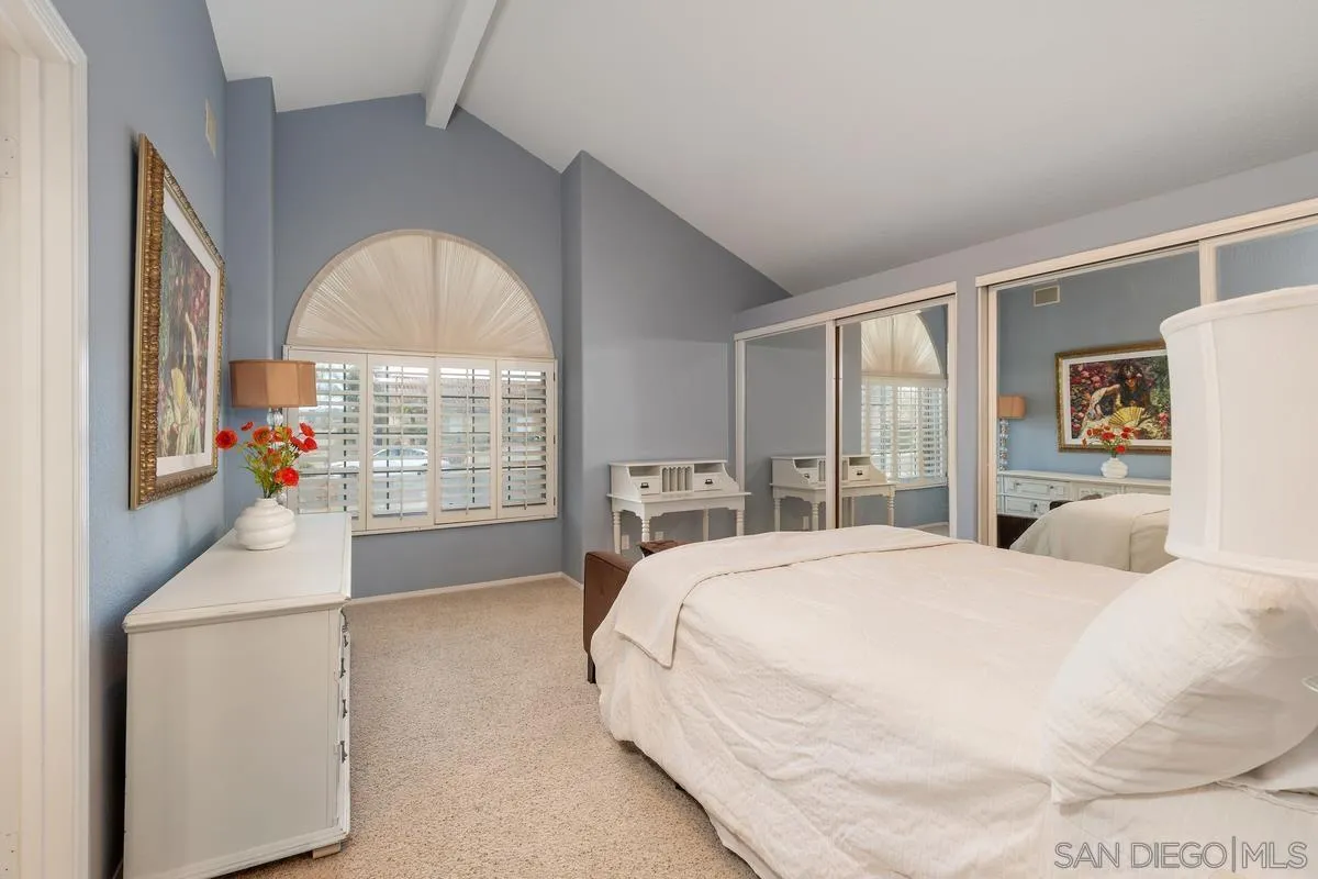 14134 Palisades Drive Poway, CA 92064 - Photo 26 of 32 a spacious bedroom with a bed and a large window