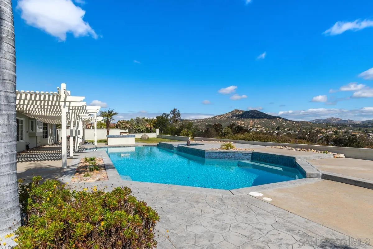 14134 Palisades Drive Poway, CA 92064 - Photo 29 of 32 a view of a swimming pool and lounge chair