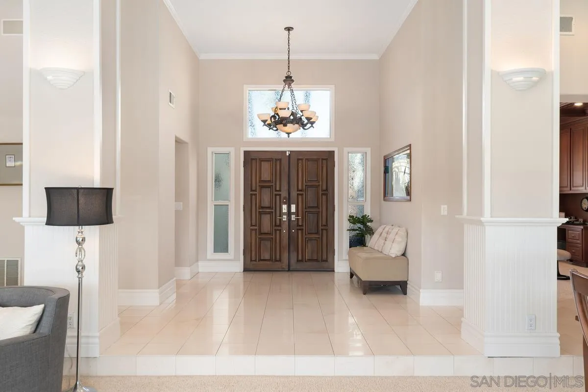 14134 Palisades Drive Poway, CA 92064 - Photo 3 of 32 a living room with furniture and a chandelier