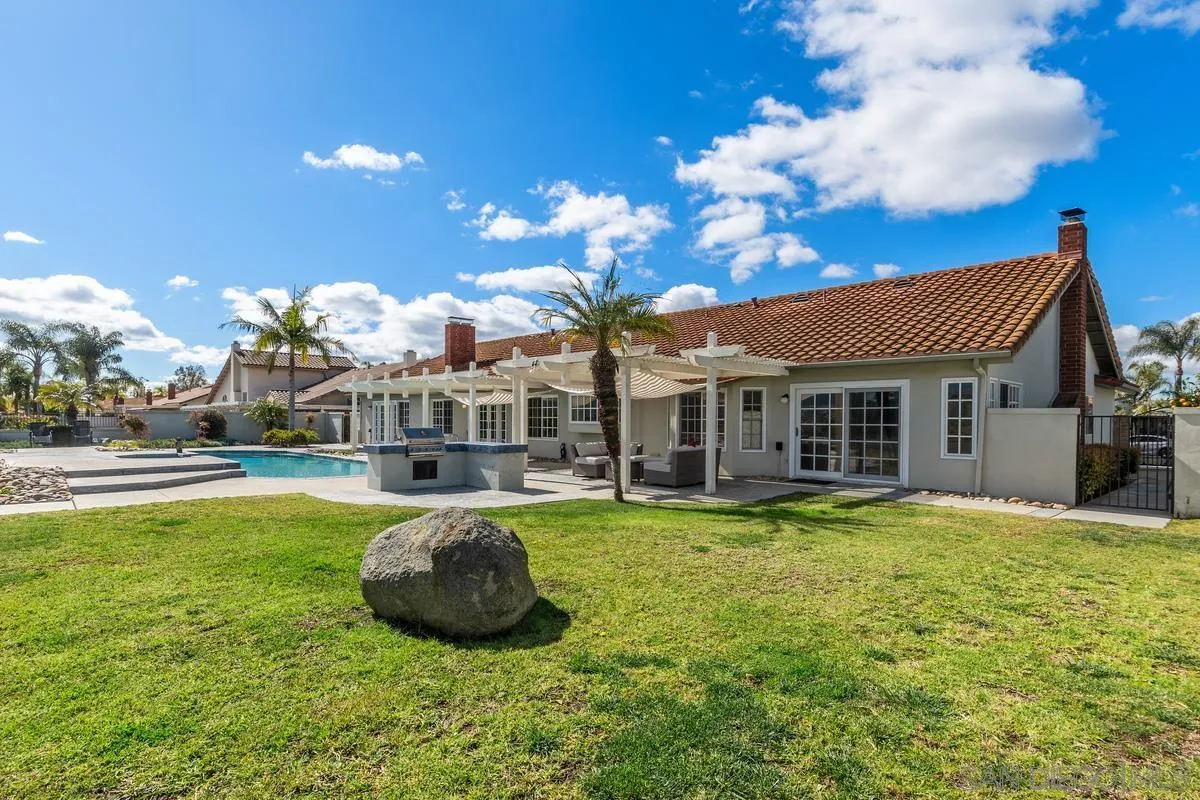 14134 Palisades Drive Poway, CA 92064 - Photo 32 of 32 a view of a house with swimming pool and sitting area