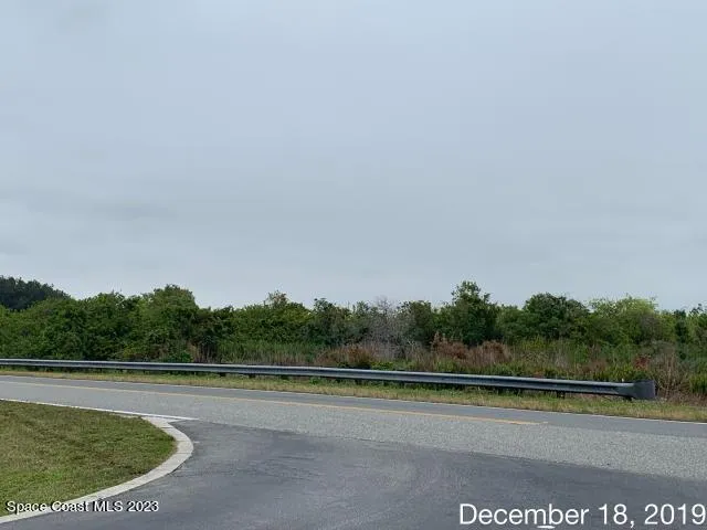 a view of a swimming pool with a yard