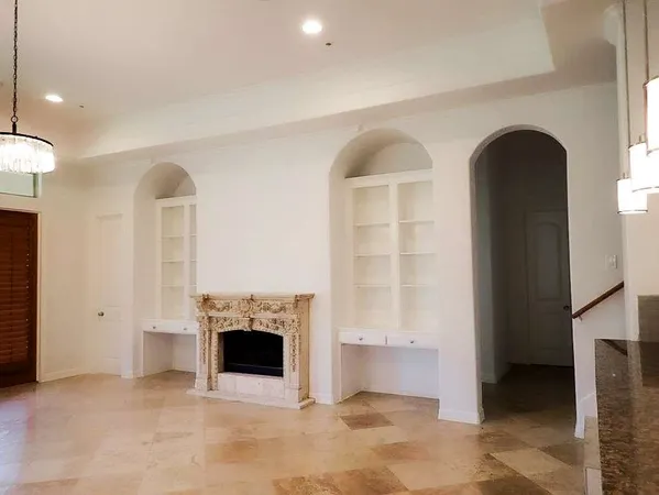 an entryway with fireplace and a window