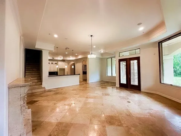 a view of a kitchen with a sink and a refrigerator