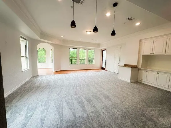 a spacious bathroom with a large tub and shower