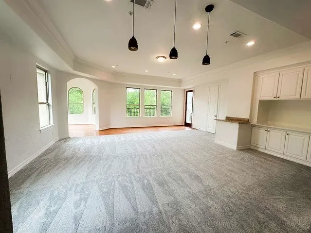 a spacious bathroom with a large tub and shower