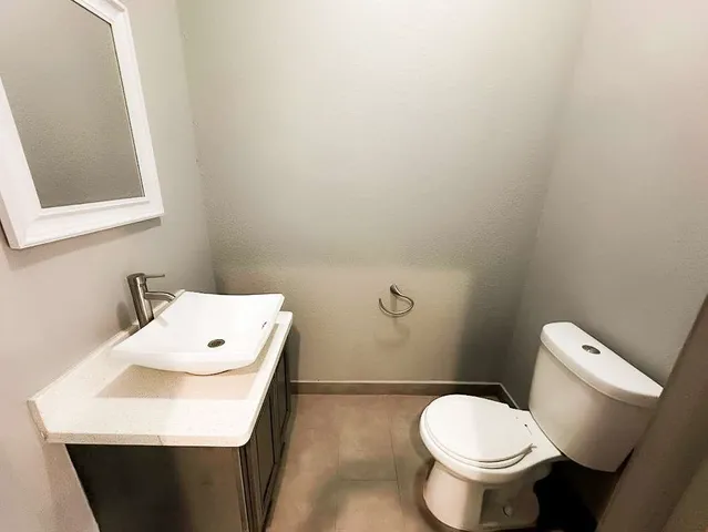 a view of walk in closet with clothes