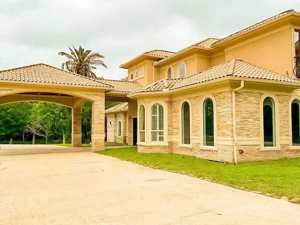 front view of a house with a swimming pool