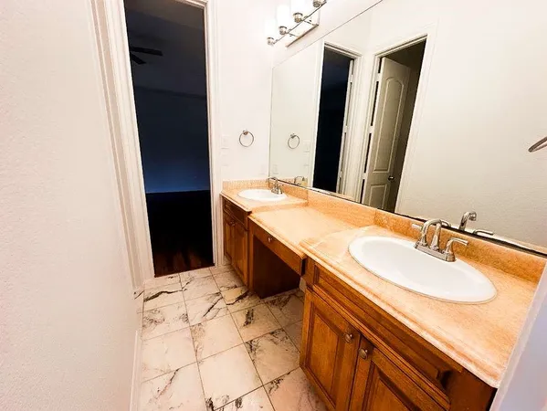 a view of a closet with wooden floor