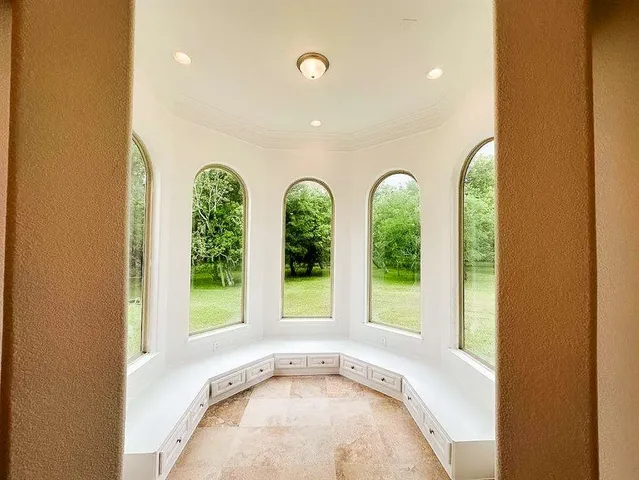 a view of an entryway with wooden floor