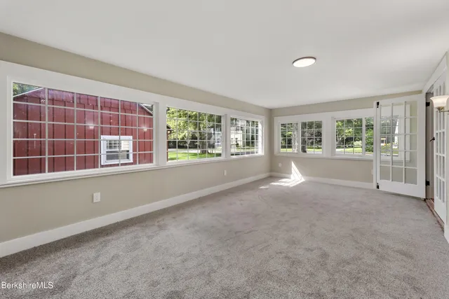 a view of livingroom with furniture wooden floor and windows