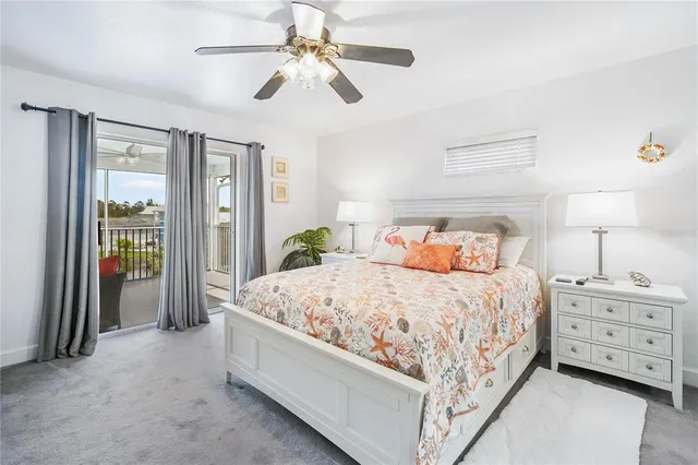 a bed room with a bed and a chandelier