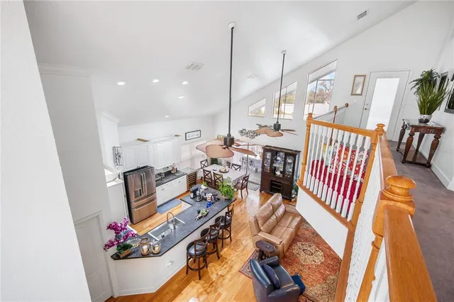 a very nice looking room with a large window and couch