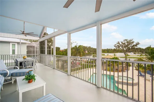 a view of a porch with furniture and garden