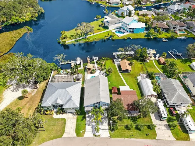 an aerial view of a house with a swimming pool yard and outdoor seating