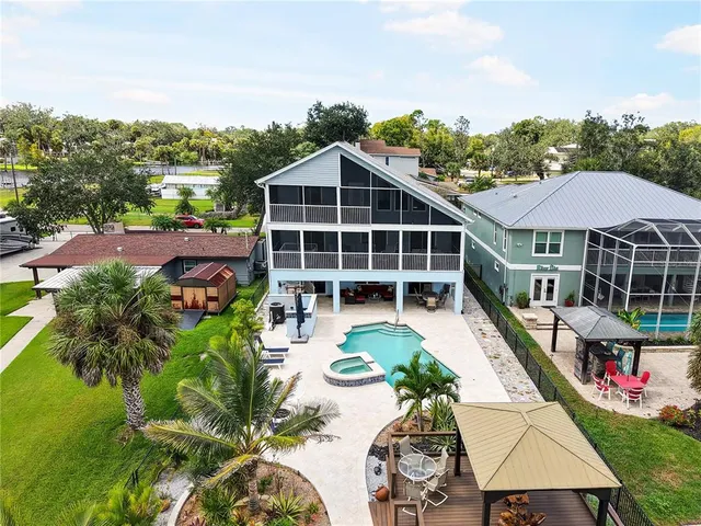 a view of a swimming pool with lounge chair